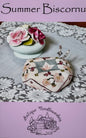 Summer Biscornu; Antique Needleworkers